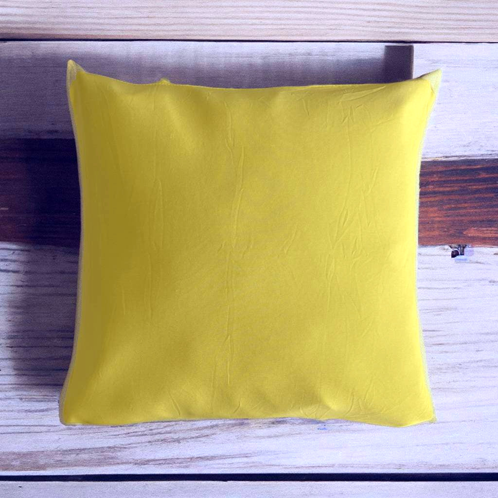 Housse de coussin jaune